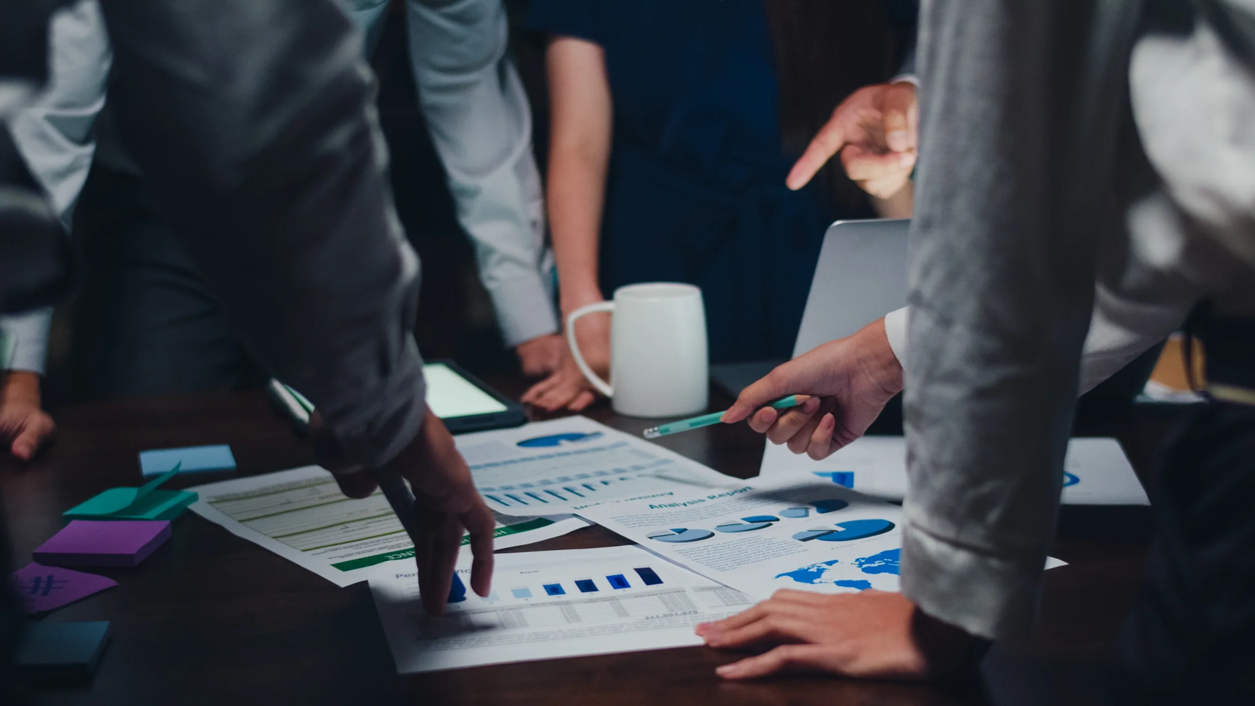 millennial asia businessmen businesswomen meeting brainstorming ideas about new paperwork project colleagues working together planning success strategy enjoy teamwork small modern night office 1 scaled
